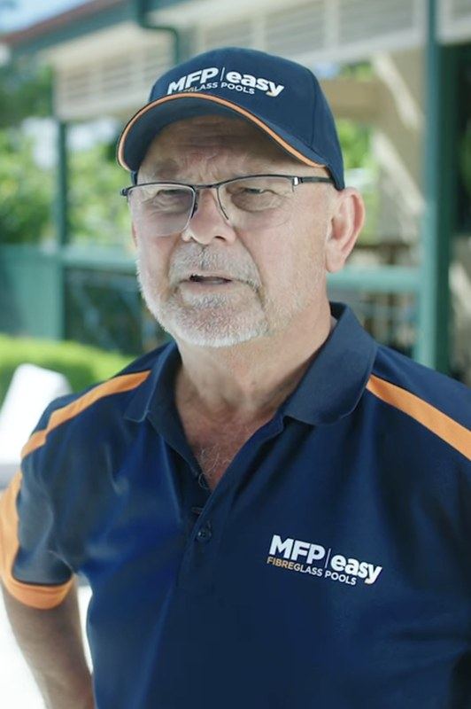 Warren Druhan, MFP Easy founding director and board member, poolside in MFP Easy uniform