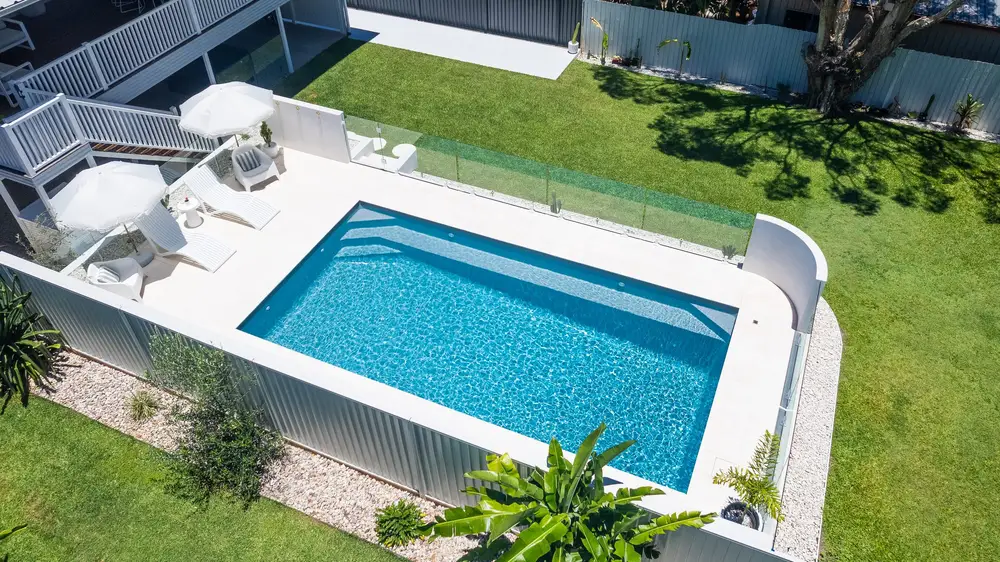 Valentina fibreglass pool in Silver Mist, aerial view with glass fencing