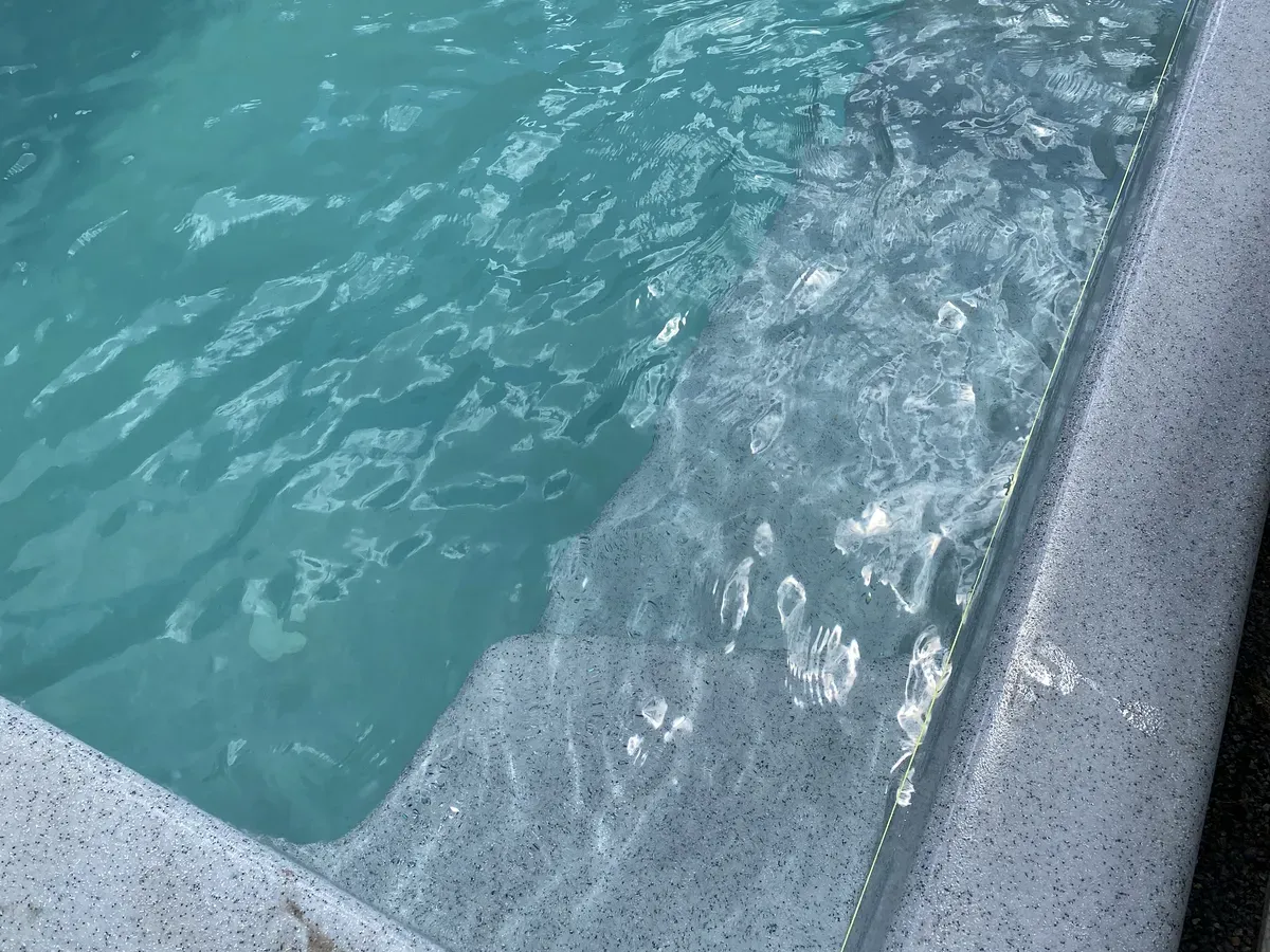 Clear water over the entry steps of a newly finished MFP fibreglass pool