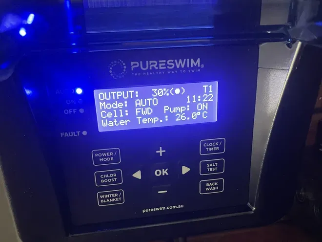PureSwim chlorinator controller on an MFP pool reading 30% output, auto mode, cell forward, pump on and 26.0 °C water temperature