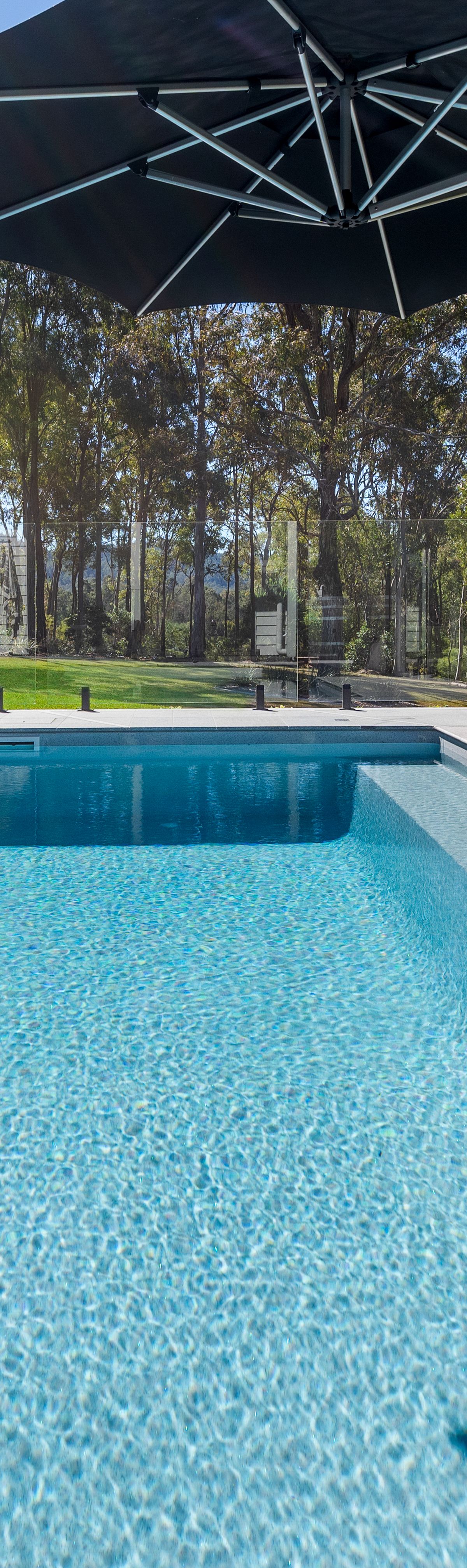 Contemporary fibreglass pool with paved surround and landscaping in Highvale, Brisbane