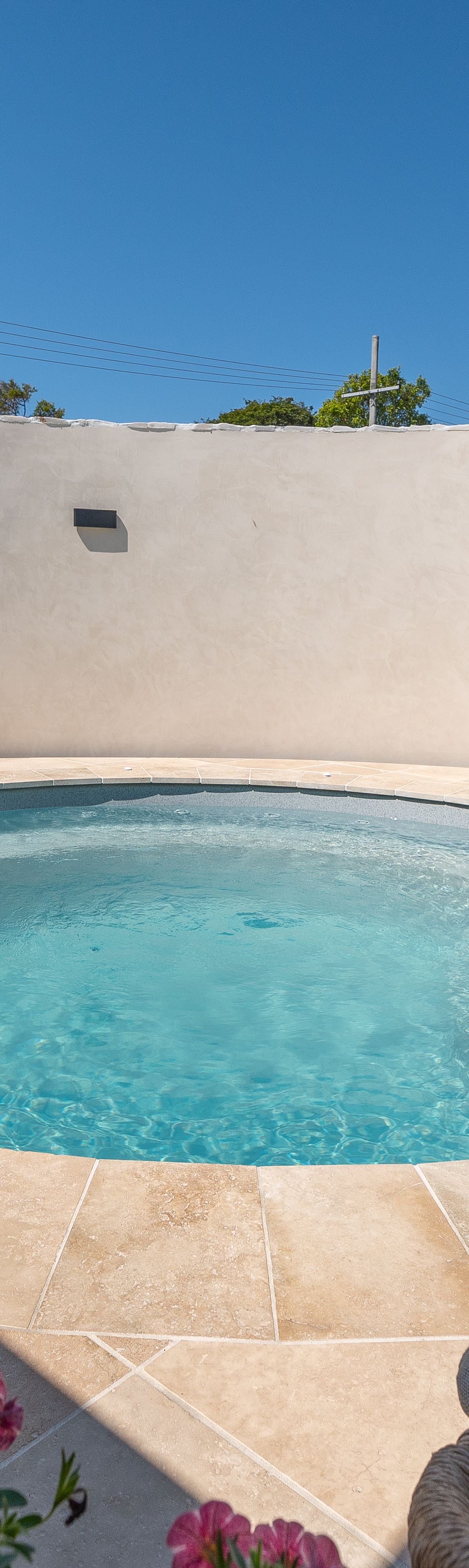 Compact round plunge pool landscaped into a small Alexandra Hills backyard