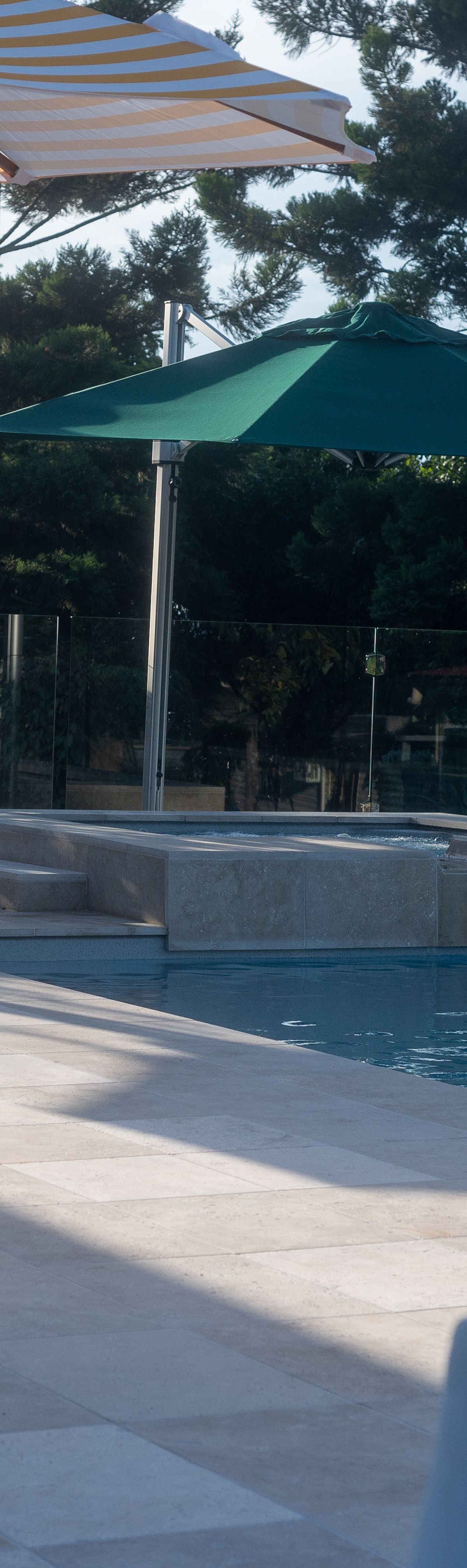 Paver pool surround around a Kensington pool and spa in Booval