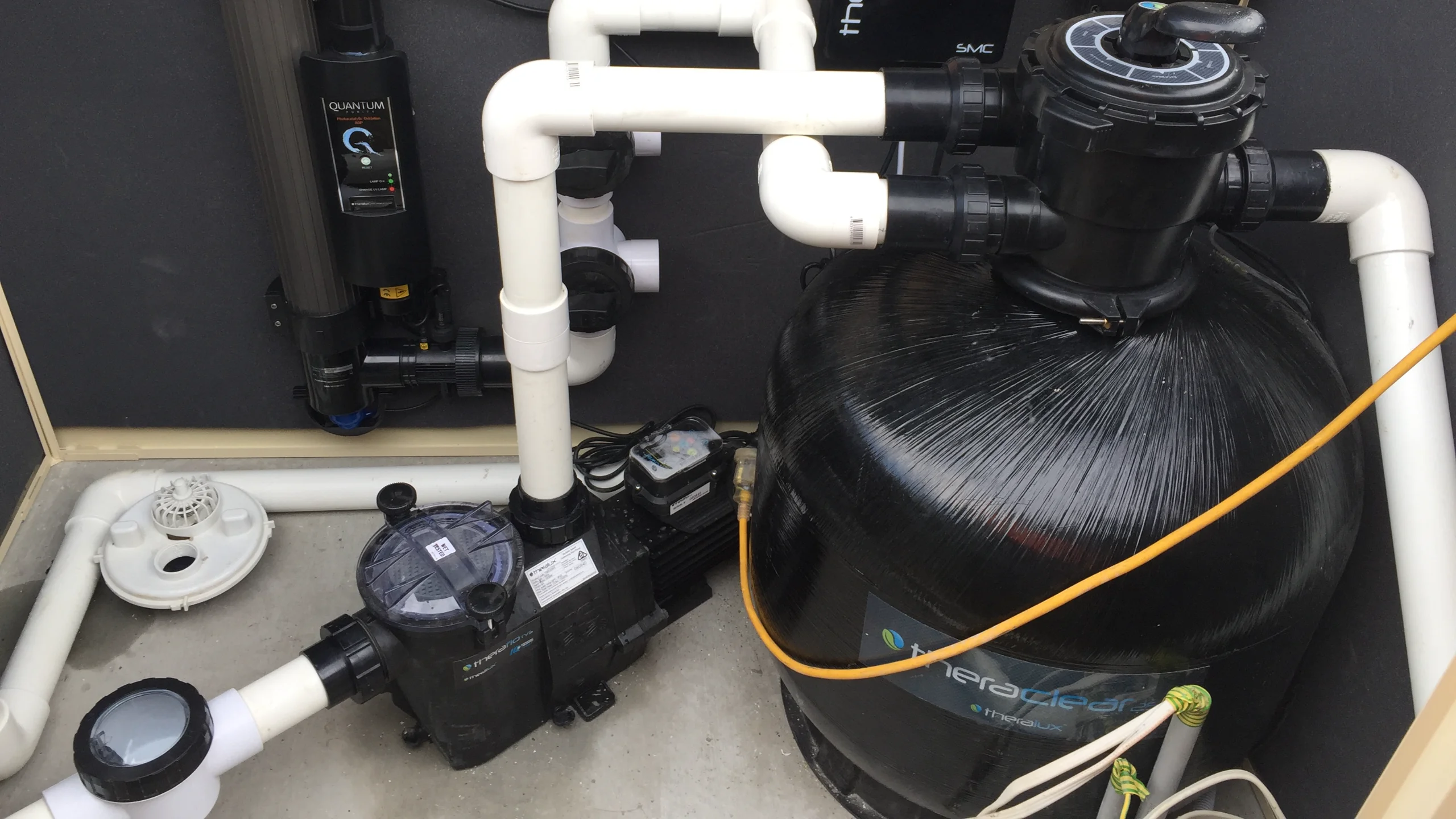 Magnesium pool maintenance equipment pad with Theralux filter, pump, chlorinator and UV unit plumbed in white pipe