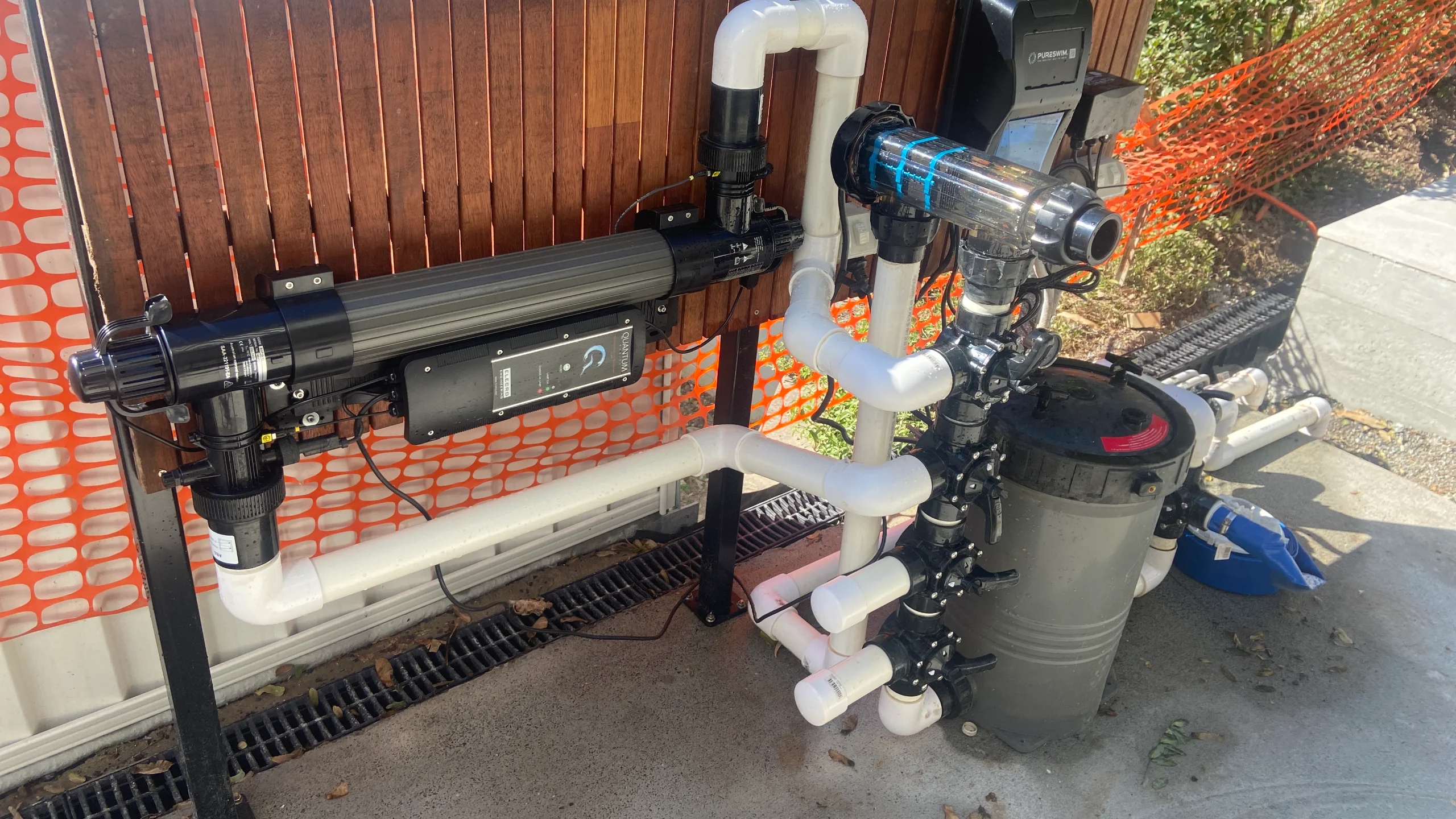 Pool circulation pump equipment pad with plumbed suction and return lines, UV unit and cartridge filter